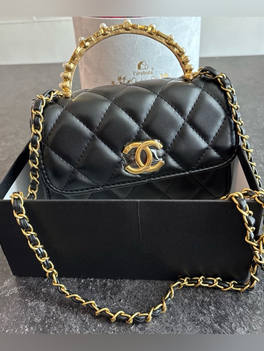 Black Vaniity crossbody shoulder bag comes with a box